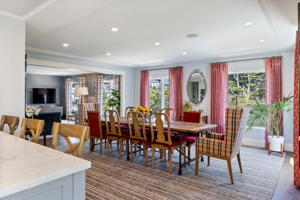 evoke-interior-designs-sacramento-ca-should-you-renovate-or-redecorate-your-home-dining-area-with-large-table-custom-window-treatments-red-color-palette-personal-residential-interior-design